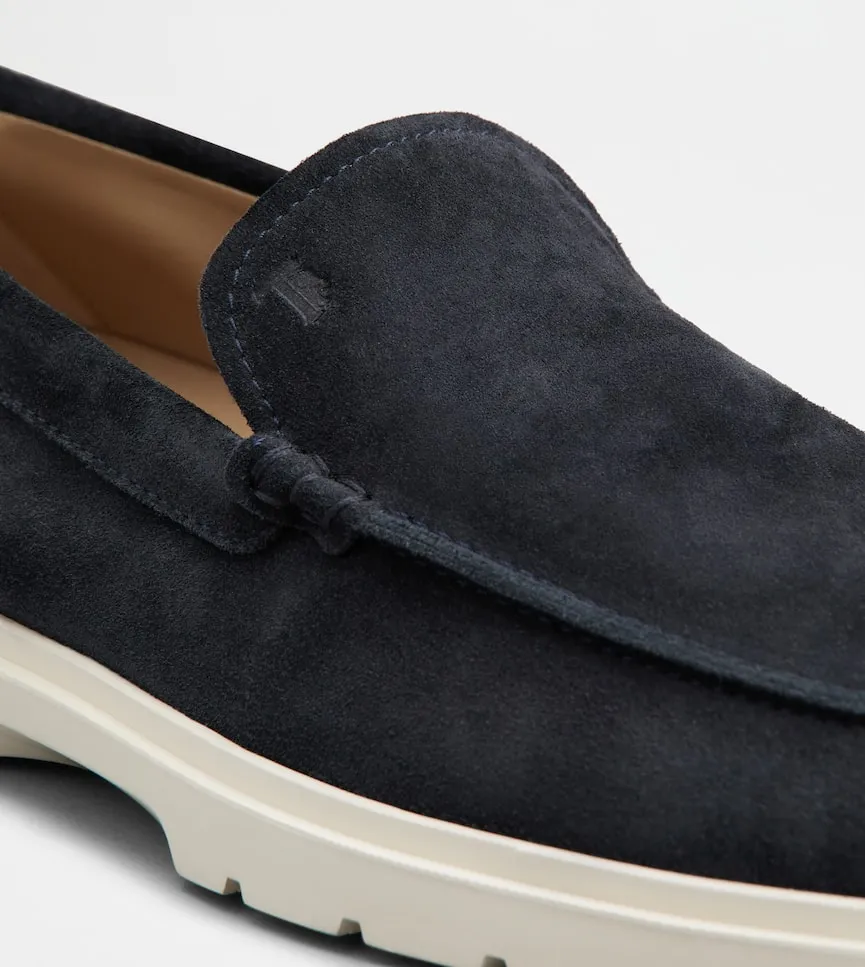 Tod's Round Toe Slip-On Loafers