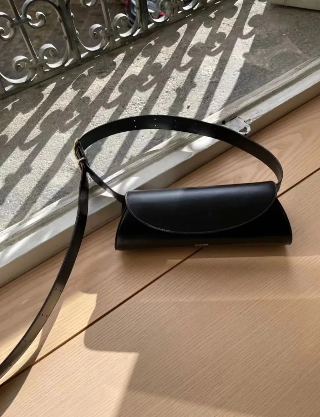 Jil Sander Cannolo Logo Embossed Small Shoulder Bag