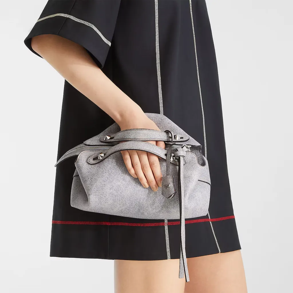 Gray Leather Bag With A Faded Denim Effect.