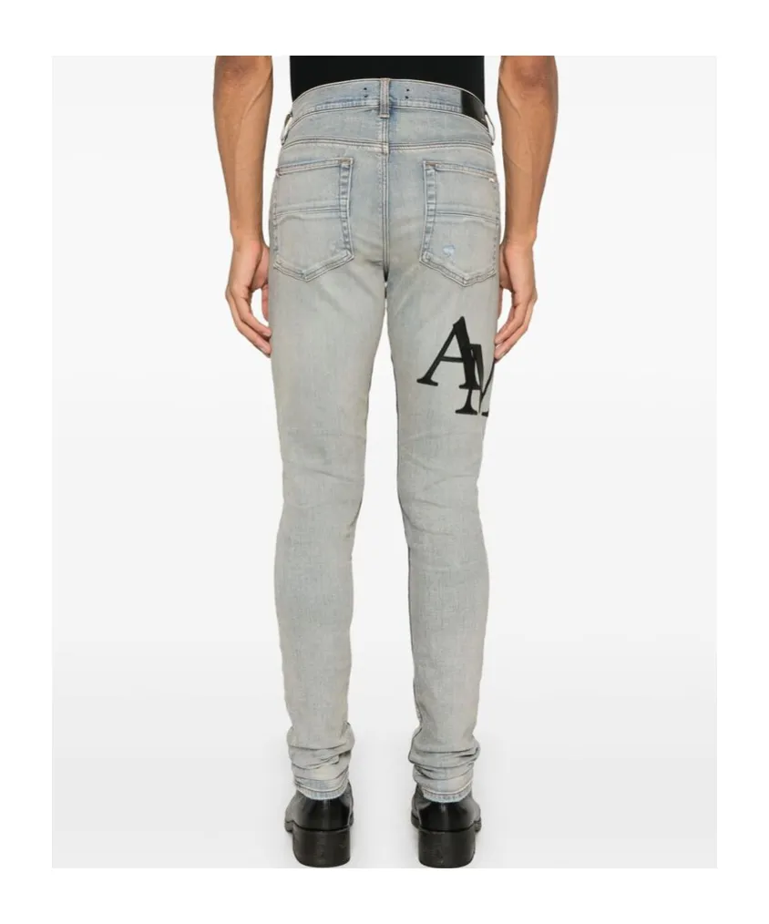 Amiri Logo Embroidered Distressed Skinny Jeans