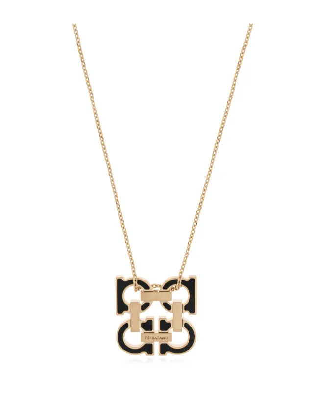 Gold Necklace With A Pendant In The Shape Of A Logo