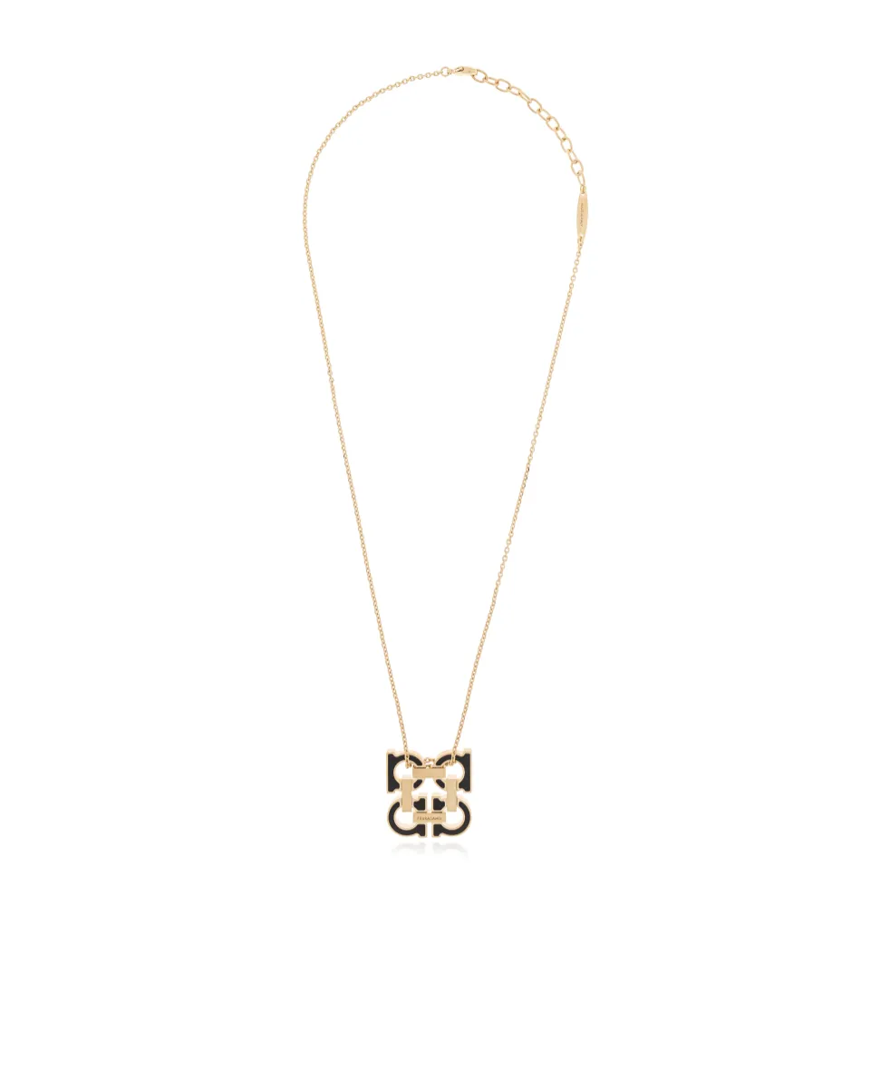 Gold Necklace With A Pendant In The Shape Of A Logo