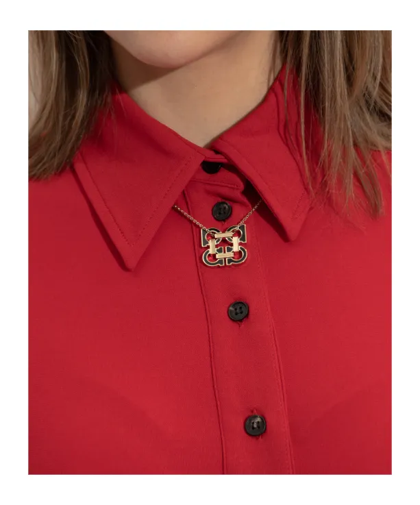 Gold Necklace With A Pendant In The Shape Of A Logo