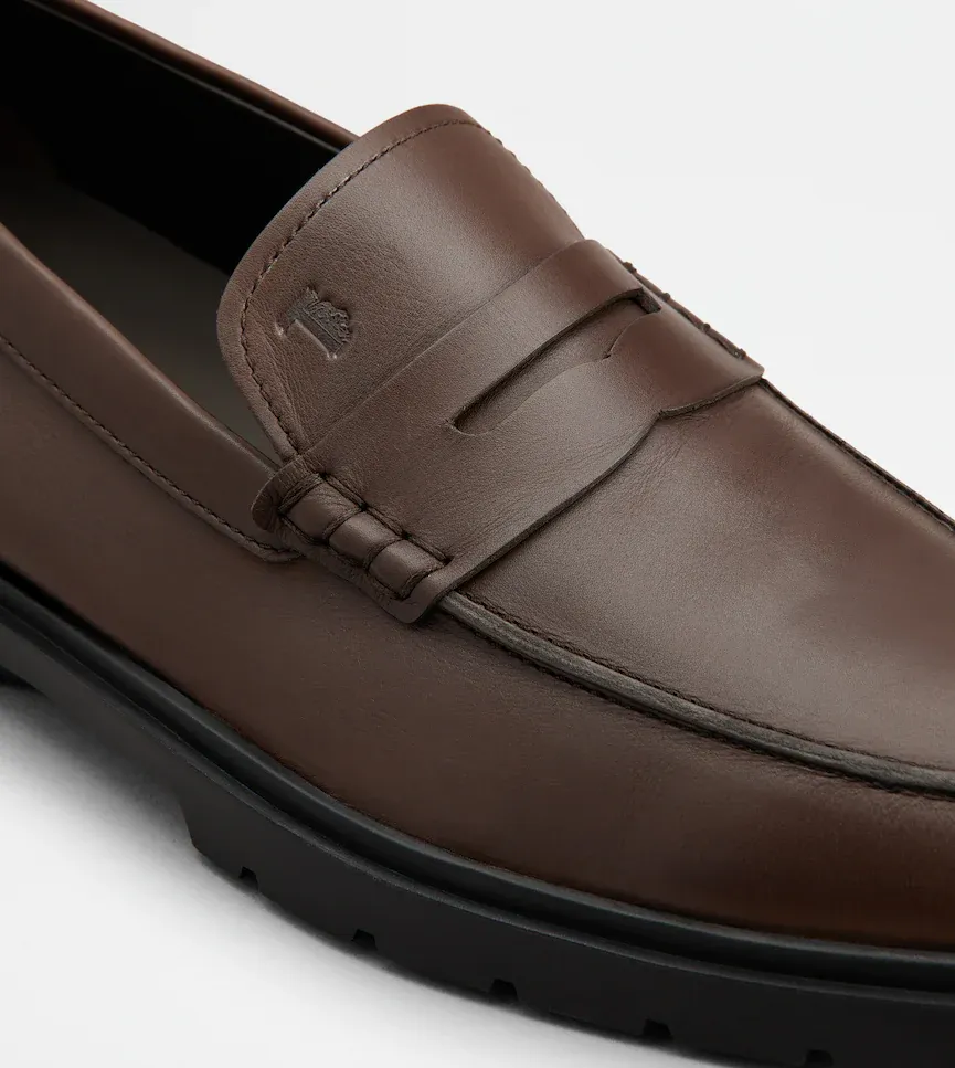 Tod's Logo Embossed Penny Loafers
