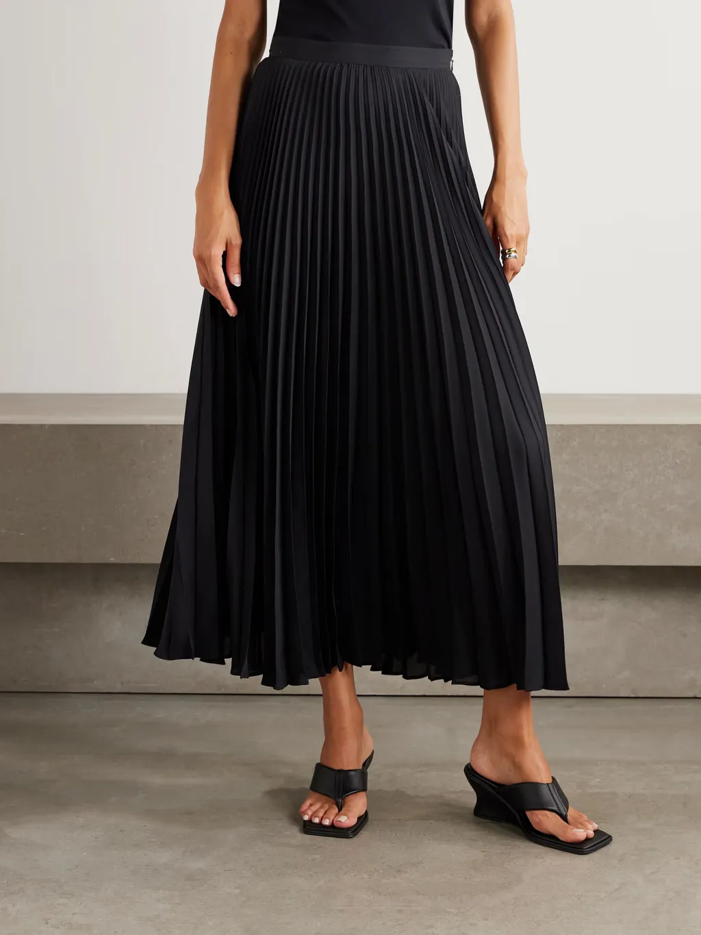 A Long Dress Made Of Pleated Crepe Fabric