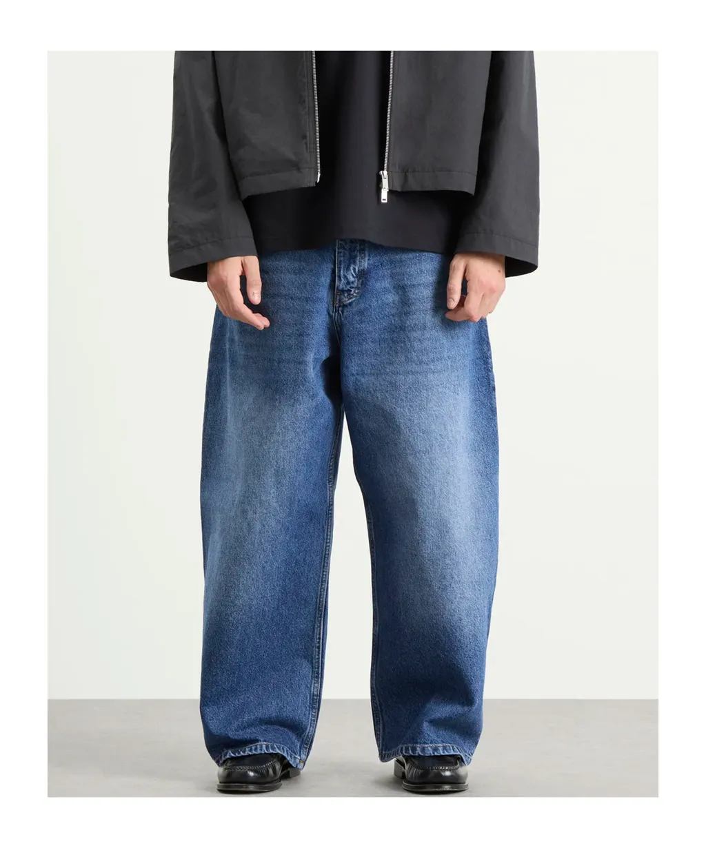 Studio Nicholson Logo Patch Cropped Wide-Leg Jeans