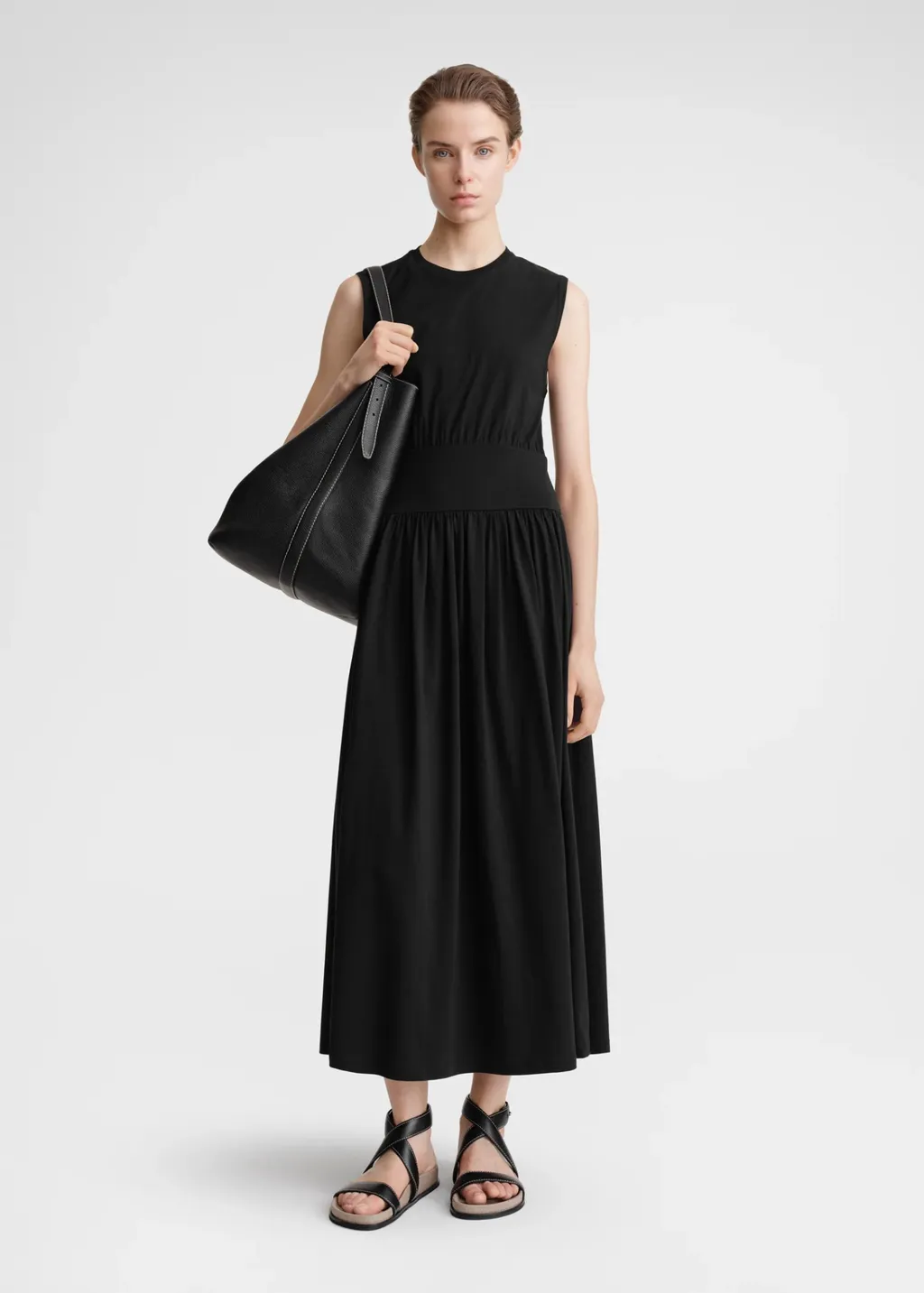 A Sleeveless Pleated Dress