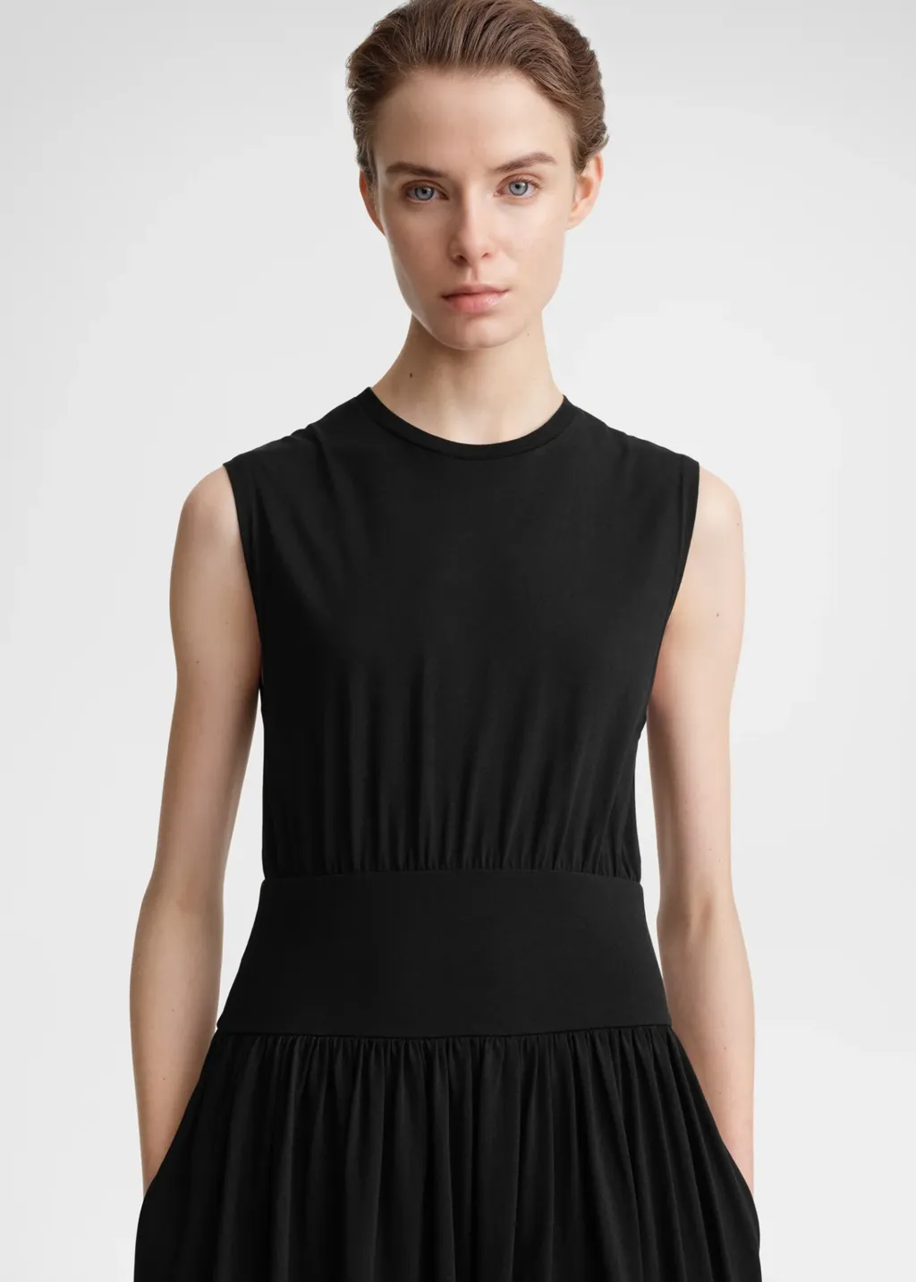 A Sleeveless Pleated Dress