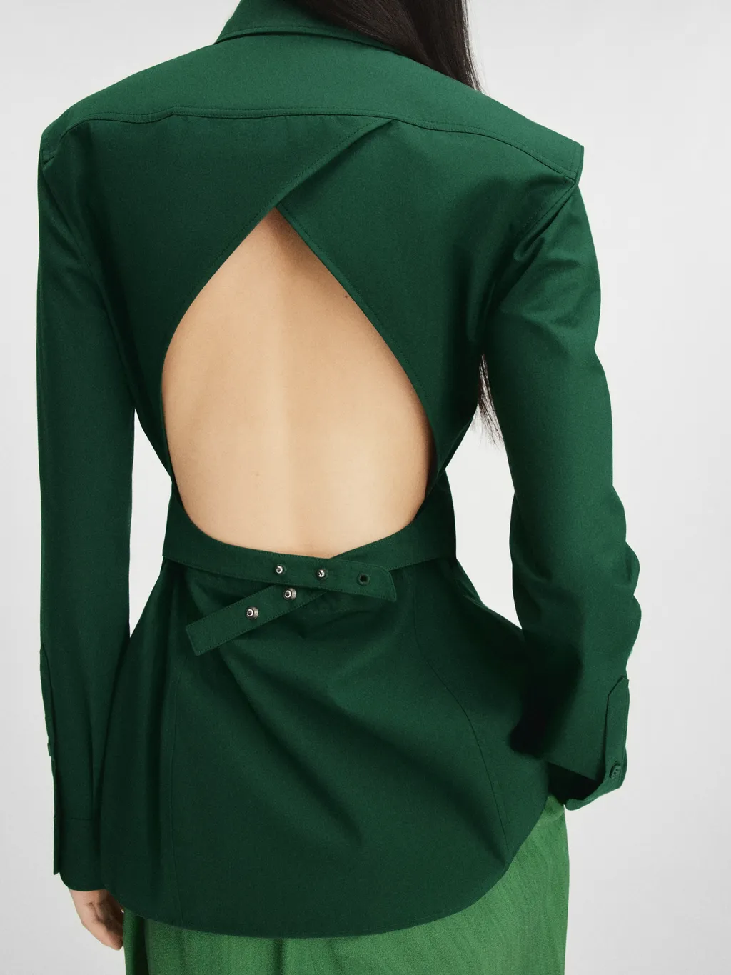 A Shirt With A Pointed Collar And A Bare Back