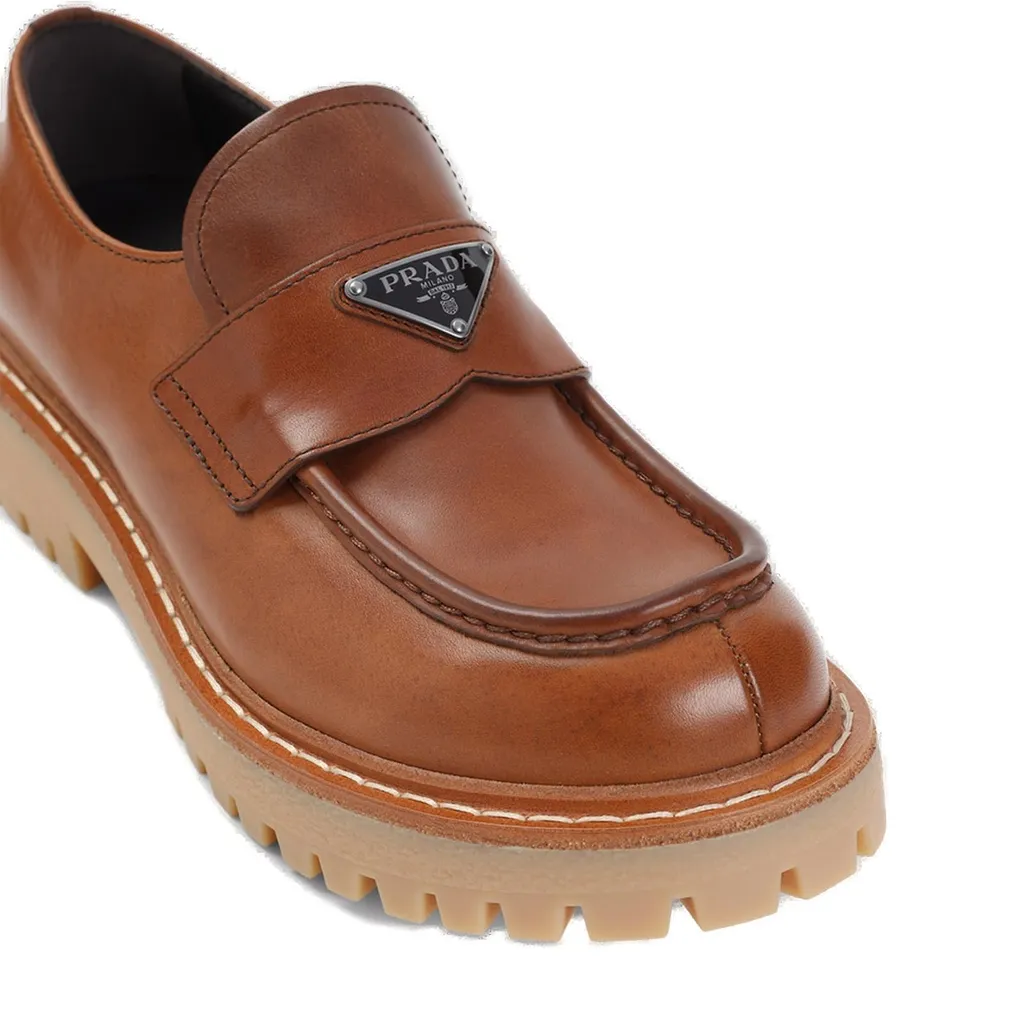 Prada Logo Plaque Round Toe Loafers
