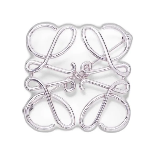 Anagram brooch in metal