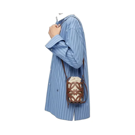 Anagram cut-out pocket in classic calfskin and canvas