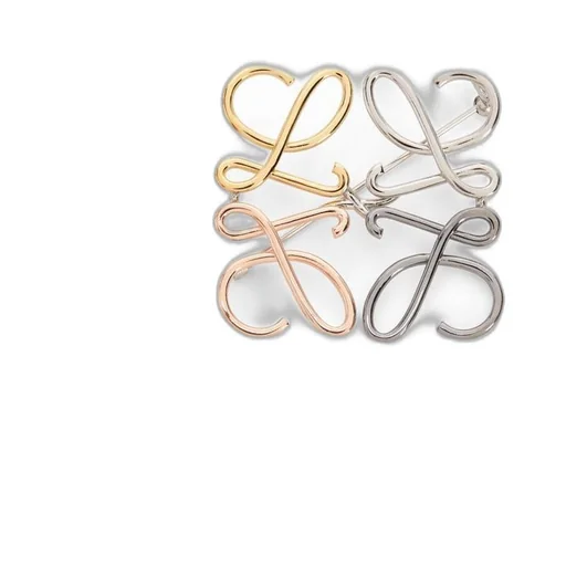 Anagram brooch in metal