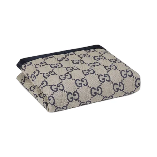 Double-sided GG quilted cotton blanket