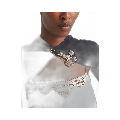 Metal brooch with crystals