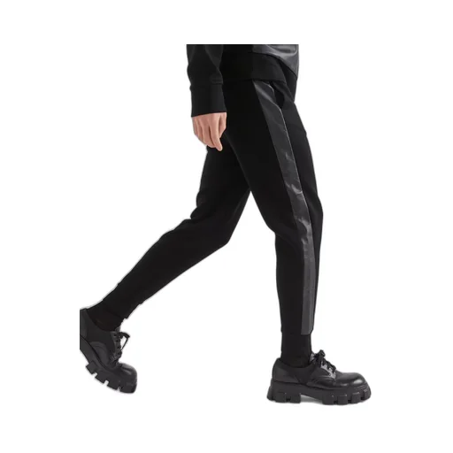 Technical fleece and leather pants