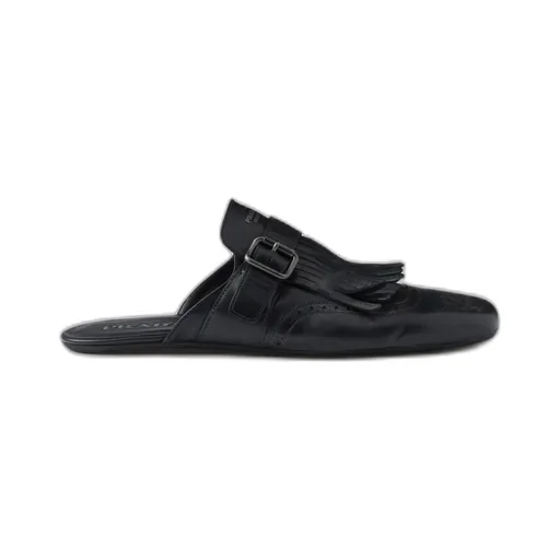 Shuffle Antiqued Leather Mules With Buckled Strap And Fringe
