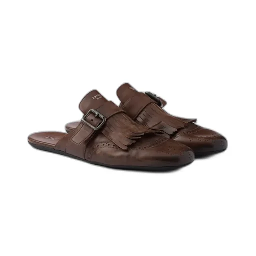 Shuffle Antiqued Leather Mules With Buckled Strap And Fringe