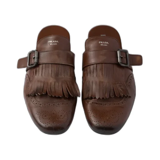 Shuffle Antiqued Leather Mules With Buckled Strap And Fringe