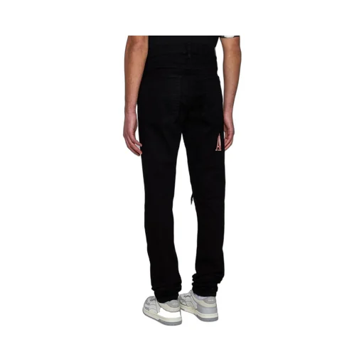 Logo Patch Distressed Skinny Jeans