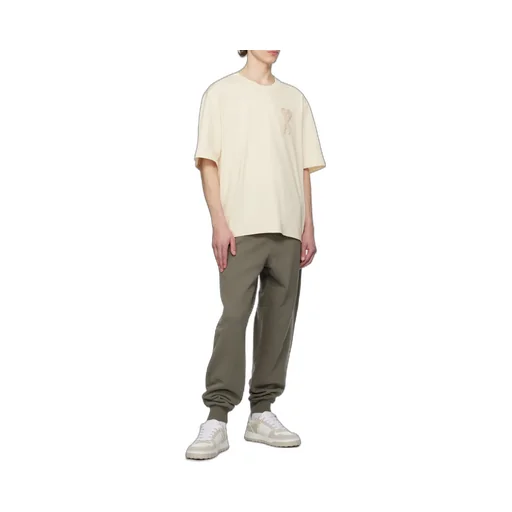 Ami Logo Embossed Low-Top Sneakers