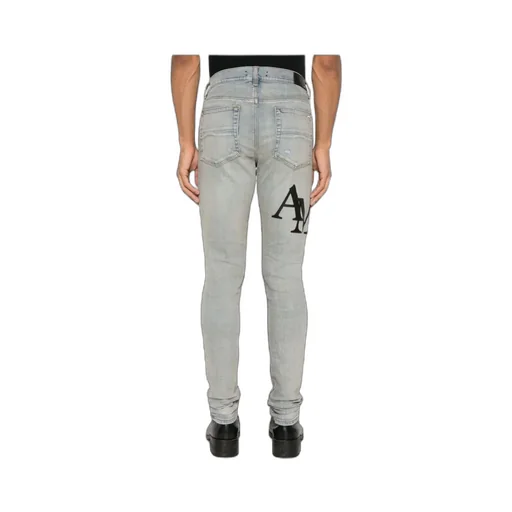Amiri Logo Embroidered Distressed Skinny Jeans