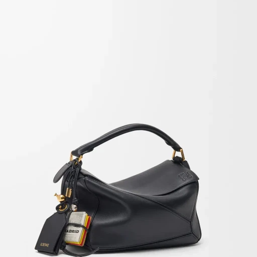 Newspaper Charm In Calfskin