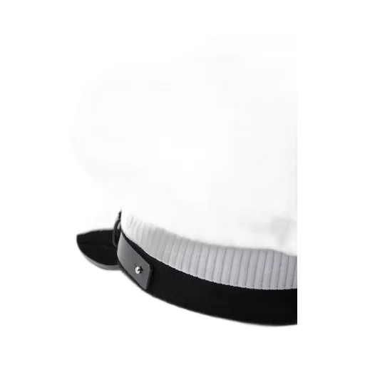 Knit and patent leather cap