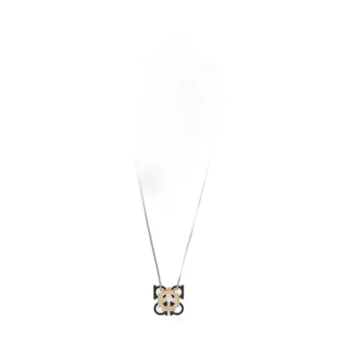 Gold Necklace With A Pendant In The Shape Of A Logo