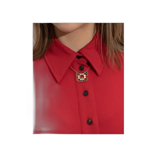 Gold Necklace With A Pendant In The Shape Of A Logo